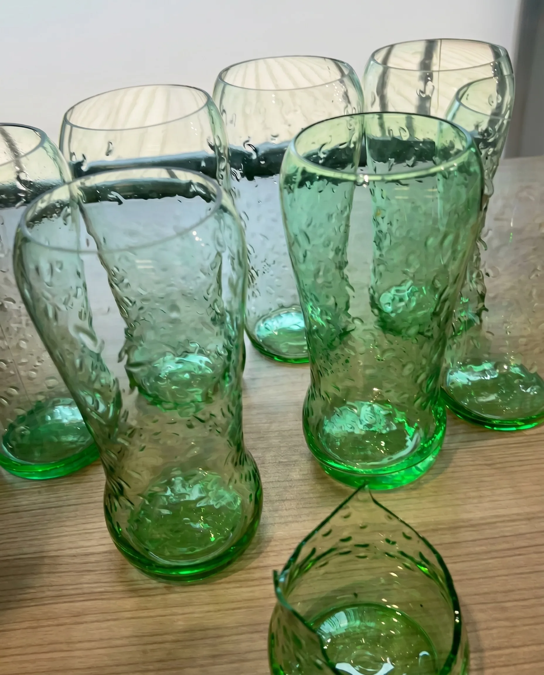 Mass-colored glassware showing natural green color variation